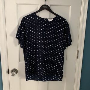 Navy polka dot blouse.